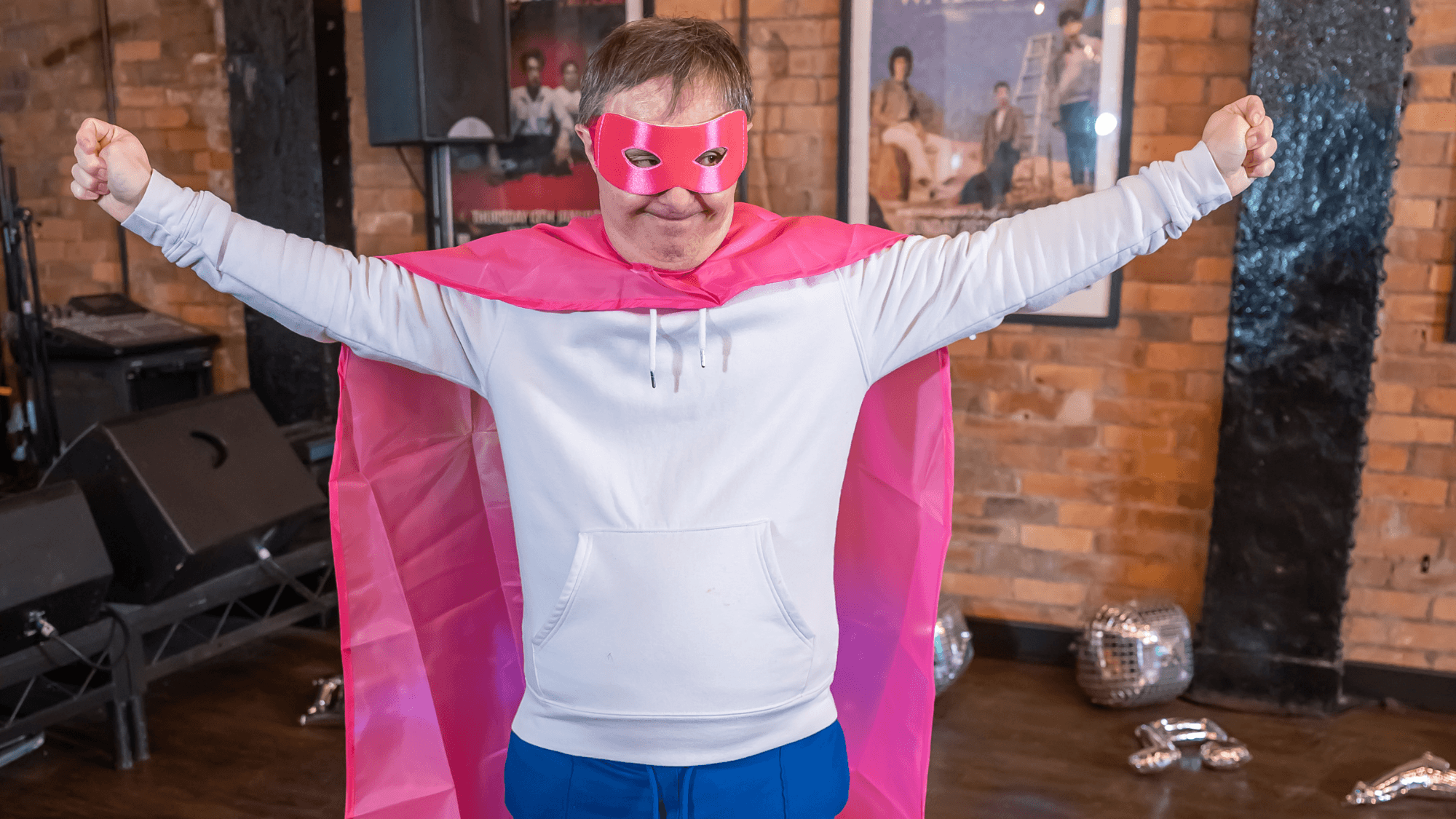 Male adult with learning disabilities dressed in a superhero costume