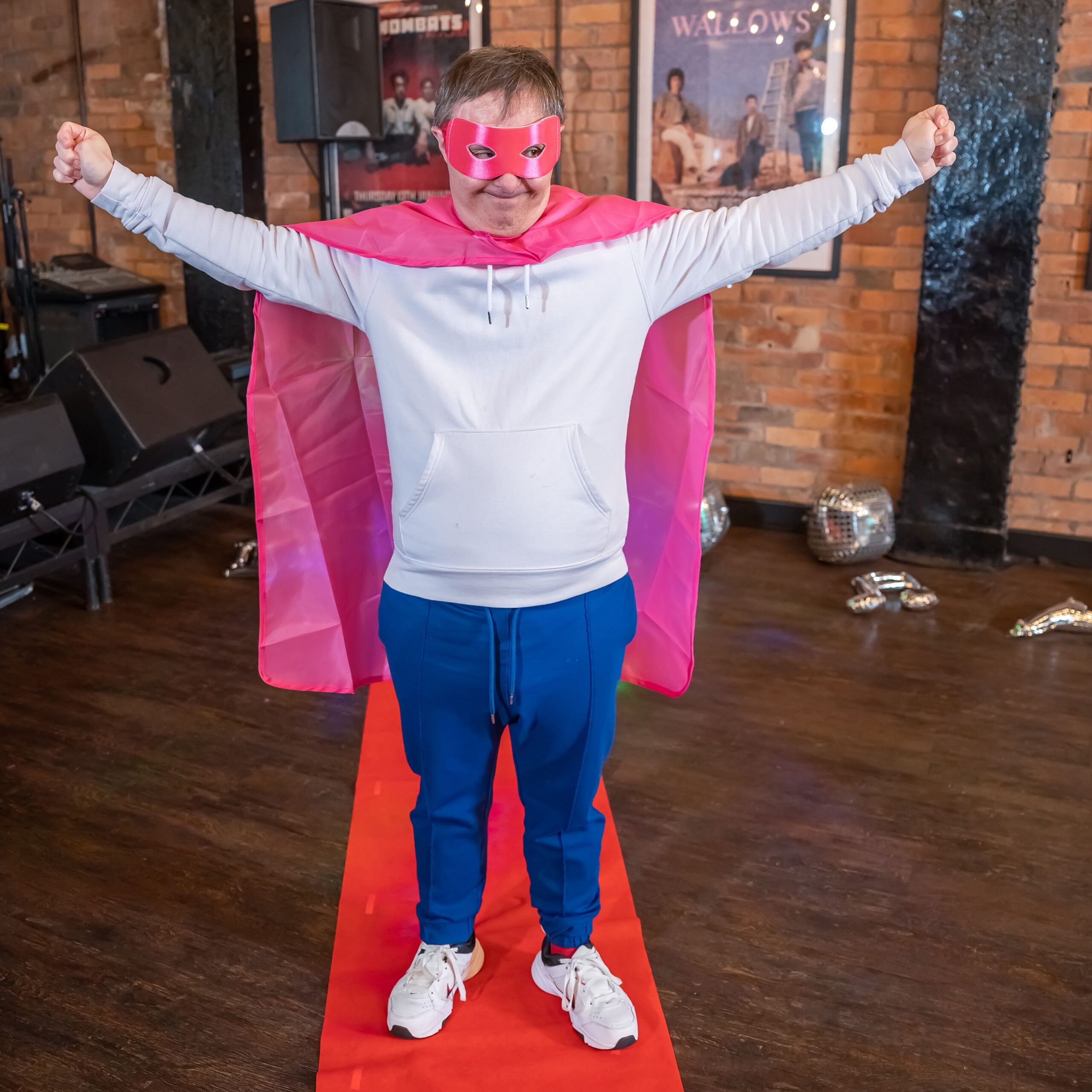 Male adult with learning disabilities dressed in a superhero costume